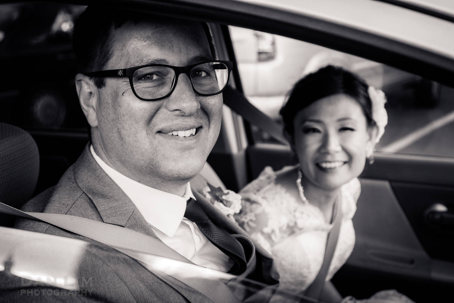 Bride and groom in the car.